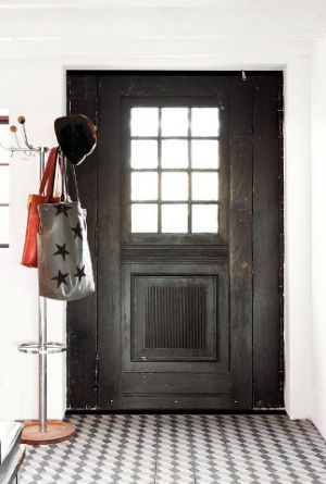 Examples of stylish floors - antique door black mosaic tiled floor entryway front entry.jpg
